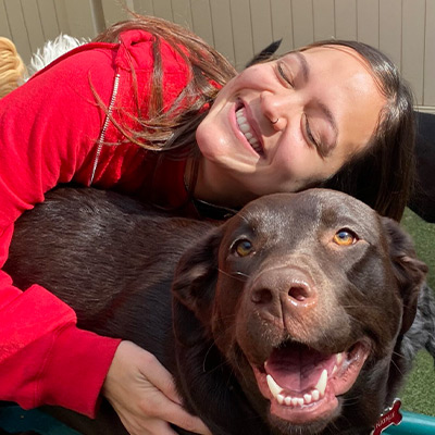 a close up of a man and a dog posing for the camera