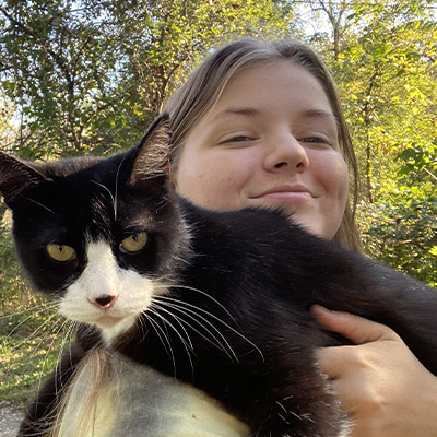 a person holding a cat