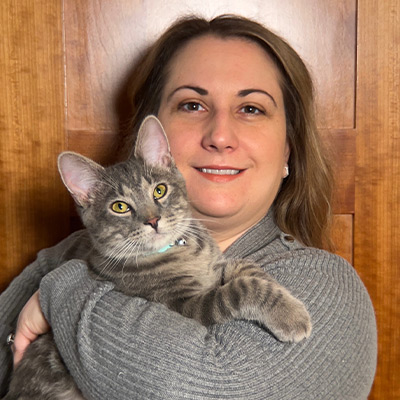 a woman holding a cat