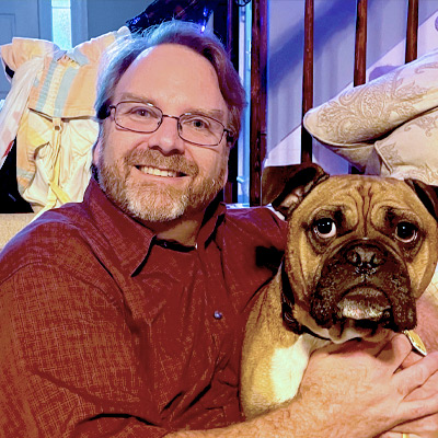 a man holding a dog
