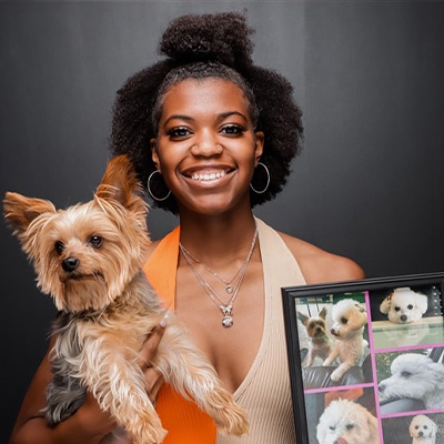 a person and a dog posing for the camera