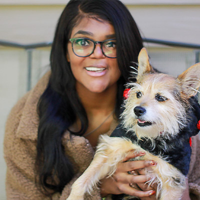 a woman holding a dog