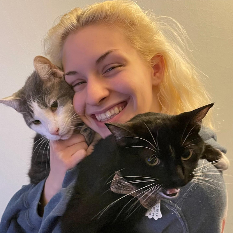 a person holding a cat