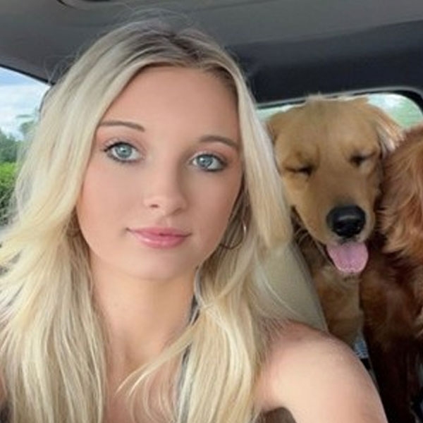 a person and a dog posing for the camera